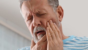 man with severe toothache