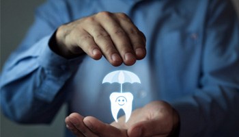 a person with a small tooth and an umbrella in his hands