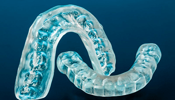 custom mouthguards for protecting a person’s dental implants