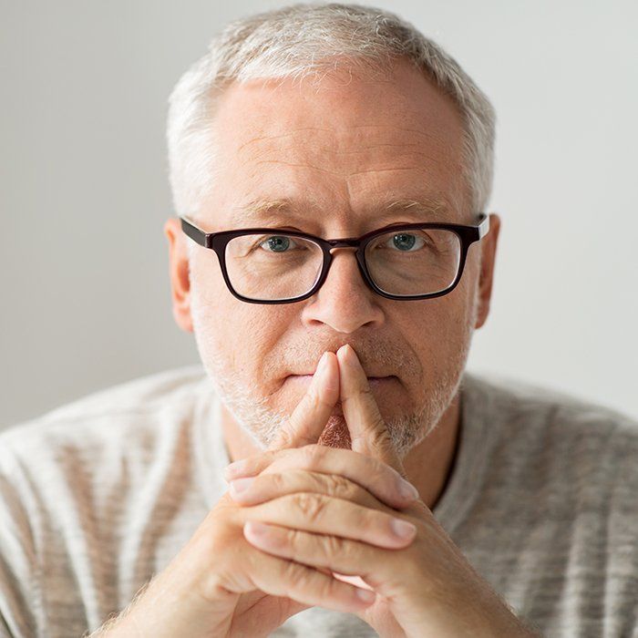 man with glasses concentrating