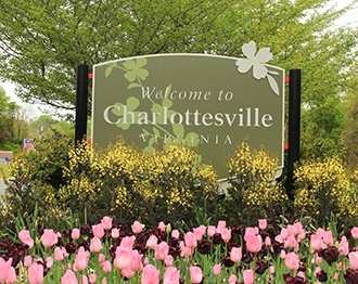 Welcome to Charlottesville sign with beautiful flowers