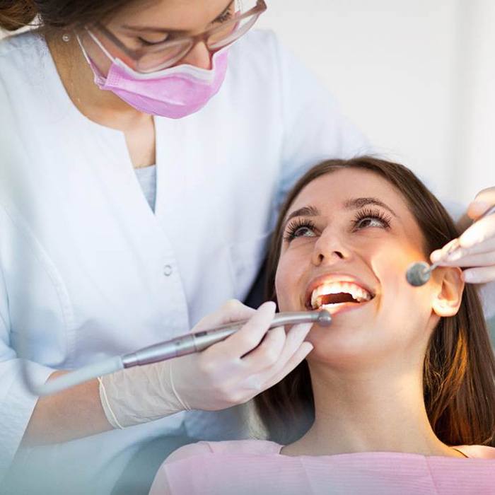 Patient smiling up at dentist