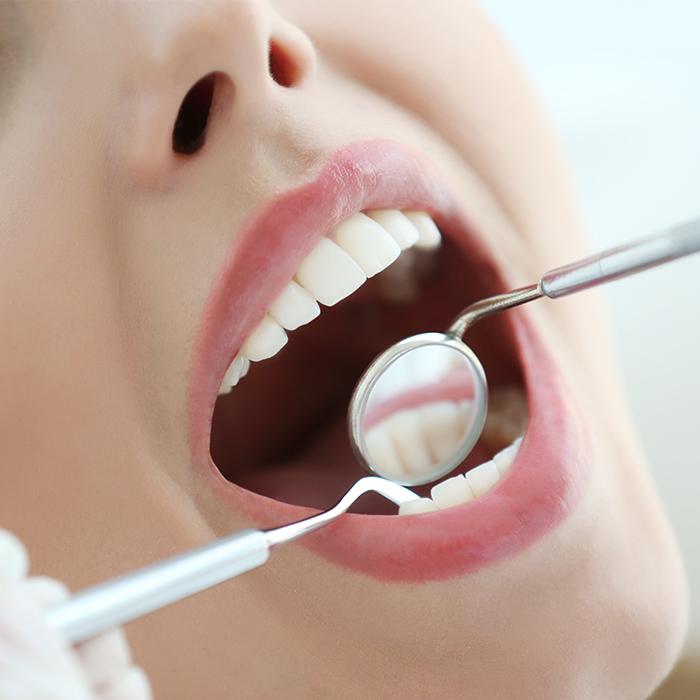 woman having root planing done for gum disease treatment in Charlottesville