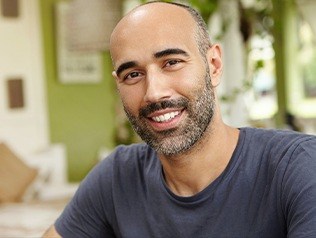 man with dental implants smiling