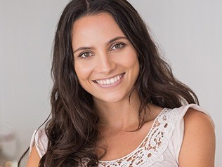 brunette woman showing off perfect smile