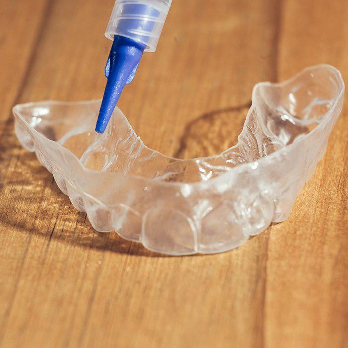 Tray for teeth whitening in Charlottesville being filled
