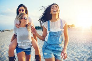 friends walking on a beach