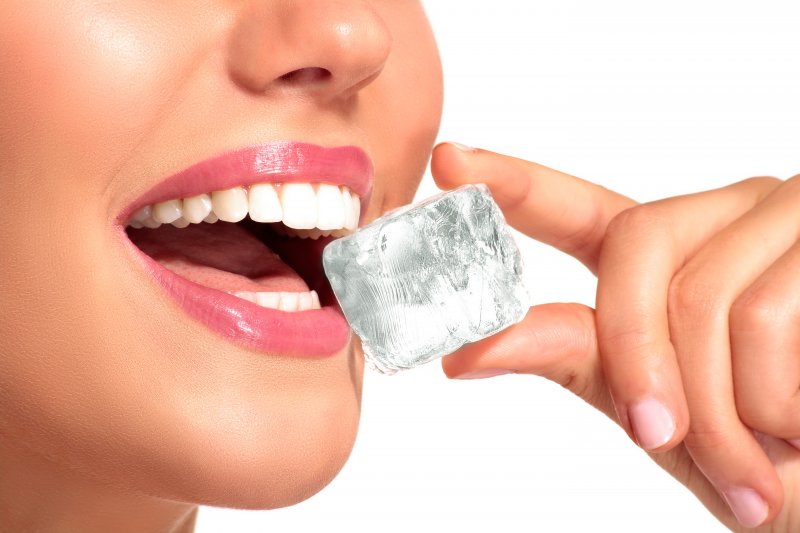 close-up of woman eating an ice cube