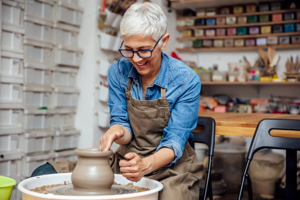 Woman smiling during ceramics class